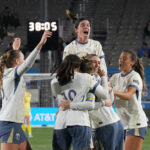 The Seattle Reign FC celebrates midfielder Maddie Mercado (2) goal against the Chicago Stars FC during the first half at Northwestern Medicine Field at Martin Stadium.