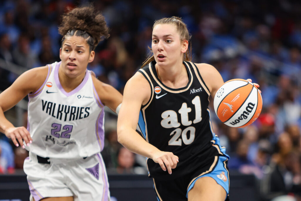 Atlanta Dream guard Isobel Borlase (20) dribbles past Golden State Valkyries guard Veronica Burton (22) in the second quarter during game three of the 2026 WNBA Finals at State Farm Arena.