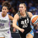 Atlanta Dream guard Isobel Borlase (20) dribbles past Golden State Valkyries guard Veronica Burton (22) in the second quarter during game three of the 2026 WNBA Finals at State Farm Arena.