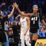 Atlanta Dream guard Jordin Canada (3) and forward Angel Reese (5) high five against the Golden State Valkyries in the fourth quarter during game three of the 2026 WNBA Finals at State Farm Arena.