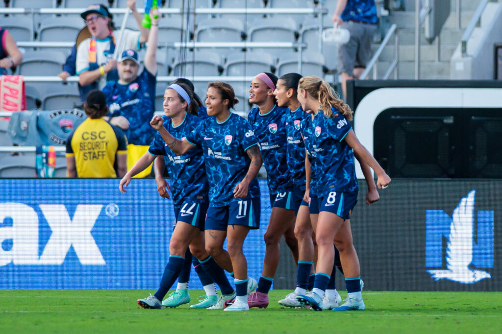 San Diego Wave FC teammates celebrate after a goal by forward Trinity Byars (15) during the second half against Boston Legacy FC at Snapdragon Stadium.