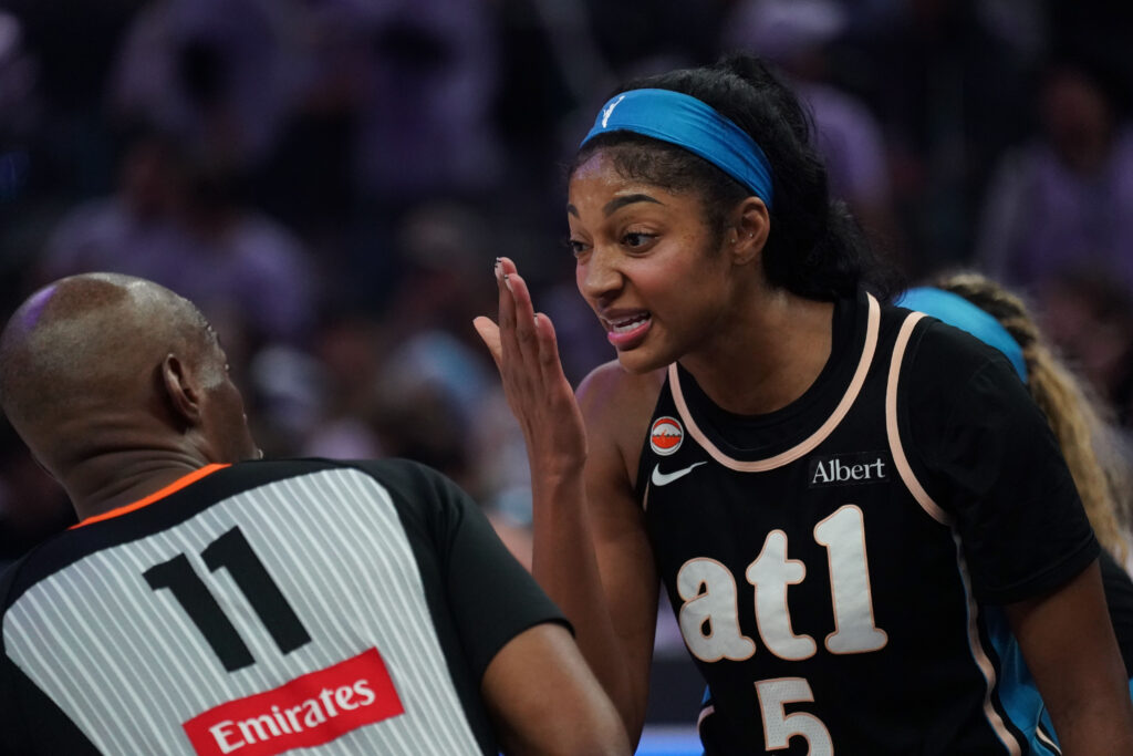 Atlanta Dream forward Angel Reese (5) talks with referee Randy Richardson (11) during the game against the Golden State Valkyries in the third quarter of game five of the 2026 WNBA Finals at Chase Center.