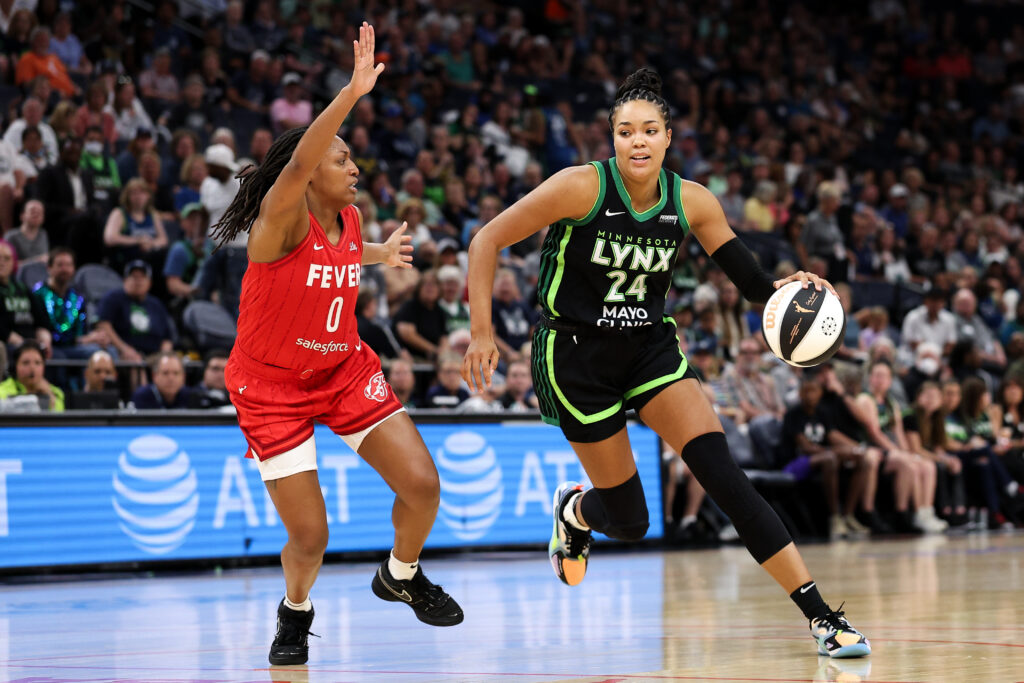 Napheesa Collier #24 of the Minnesota Lynx works around Kelsey Mitchell #0 of the Indiana Fever during the third quarter of the championship game of the 2025 Commissioners Cup at Target Center on July 1, 2025 in Minneapolis, Minnesota.