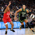 Napheesa Collier #24 of the Minnesota Lynx works around Kelsey Mitchell #0 of the Indiana Fever during the third quarter of the championship game of the 2025 Commissioners Cup at Target Center on July 1, 2025 in Minneapolis, Minnesota.