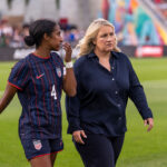 Naomi Girma #4 talks with Emma Hayes of the United States during a game between Ireland and the USWNT at Dick's Sporting Goods Park on June 26, 2025 in Commerce City, Colorado.