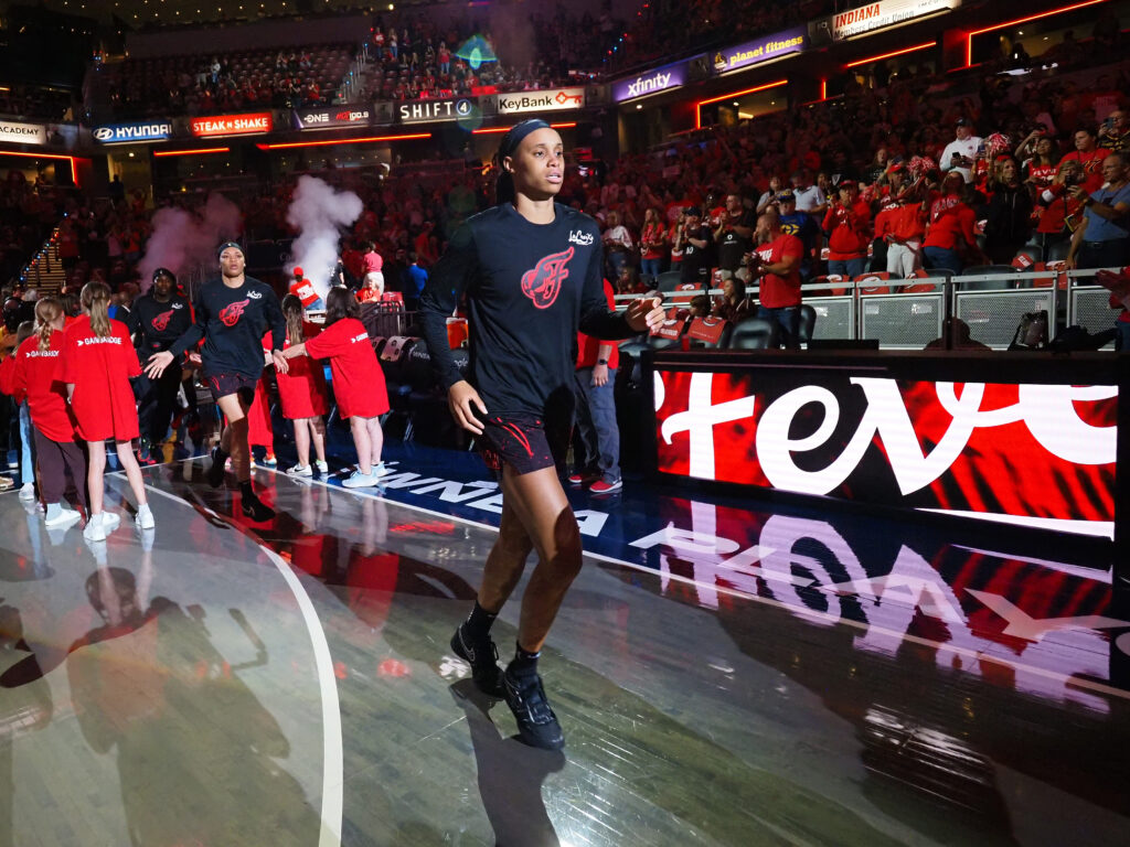 Brianna Turner #11 of the Indiana Fever run on to the court before Game 3 of the WNBA Playoffs semifinals against the Las Vegas Aces on September 26, 2025 at Gainbridge Fieldhouse in Indianapolis, Indiana.