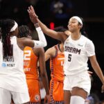 Angel Reese #5 of the Atlanta Dream reacts with Rhyne Howard #10 after drawing a foul against the Connecticut Sun during the second quarter at Gateway Center Arena.