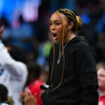 Atlanta owner Renee Montgomery reacts on the sideline during the WNBA game between the Toronto Tempo and the Atlanta Dream.