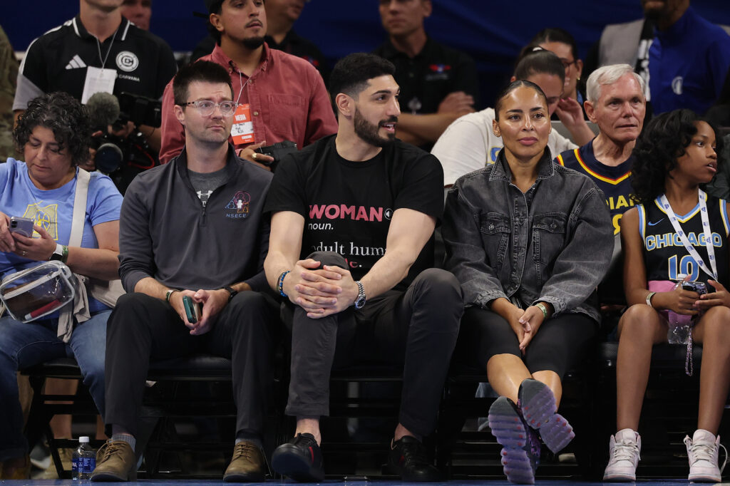 CHICAGO, ILLINOIS - AUGUST 23: Former basketball player Enes Kanter Freedom looks on courtside during the first half between the Chicago Sky and the Indiana Fever at Wintrust Arena on August 23, 2026 in Chicago, Illinois.