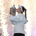 Elena Rybakina of Kazakhstan celebrates with the trophy after defeating Aryna Sabalenka in their Women's Singles Final match on Day Fourteen of the 2026 US Open at USTA Billie Jean King National Tennis Center.