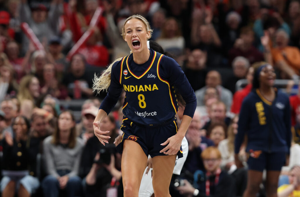 Sophie Cunningham #8 of the Indiana Fever celebrates after making a three point shot in the first half against the Minnesota Lynx at Gainbridge Fieldhouse.