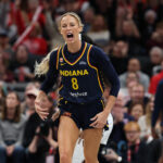 Sophie Cunningham #8 of the Indiana Fever celebrates after making a three point shot in the first half against the Minnesota Lynx at Gainbridge Fieldhouse.