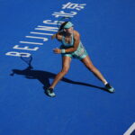 Mirra Andreeva in action during their Women's Singles Round of 32 match against Polina Kudermetova of Uzbekistan on day five of China Open at the National Tennis Center.