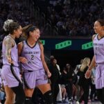 Kaitlyn Chen #2, Gabby Williams #1, and Kiah Stokes #41 of the Golden State Valkyries smile during the game against the Las Vegas Aces during Game One of the WNBA Playoff Semifinals at Chase Center on October 4, 2026.