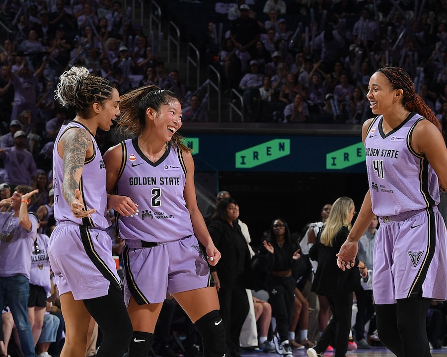 Kaitlyn Chen #2, Gabby Williams #1, and Kiah Stokes #41 of the Golden State Valkyries smile during the game against the Las Vegas Aces during Game One of the WNBA Playoff Semifinals at Chase Center on October 4, 2026.