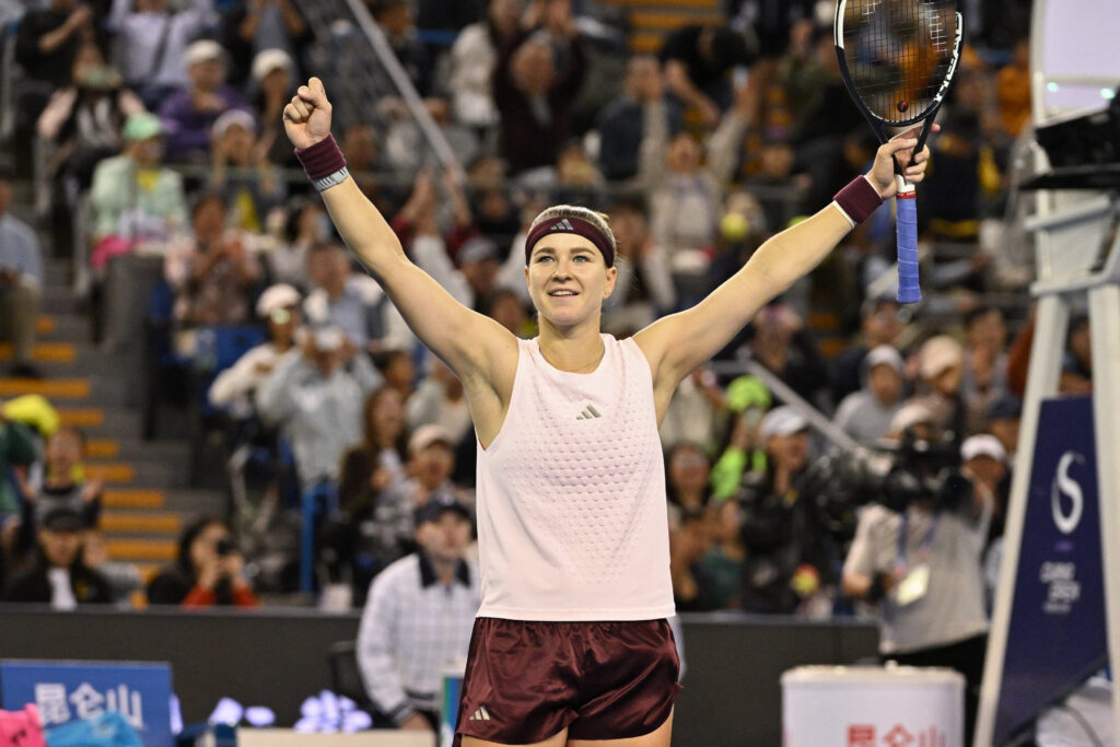 Czech Republic's Karolina Muchova celebrates after beating Japan's Naomi Osaka in their women's singles match at the China Open tennis tournament in Beijing.