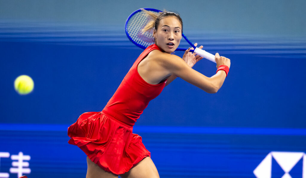 Qinwen Zheng of China in action against Alina Charaeva of Armenia in the fourth round on Day 8 of the China Open at National Tennis Center.