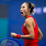 Qinwen Zheng of China in action against Elina Svitolina of Ukraine in the quarter-final on Day 10 of the China Open at National Tennis Center.