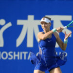 Katie Boulter of Great Britain plays Viktorija Golubic of Switzerland during their round of 16 singles match at the 2026 Kinoshita Group Japan Open Women's tennis tournament.