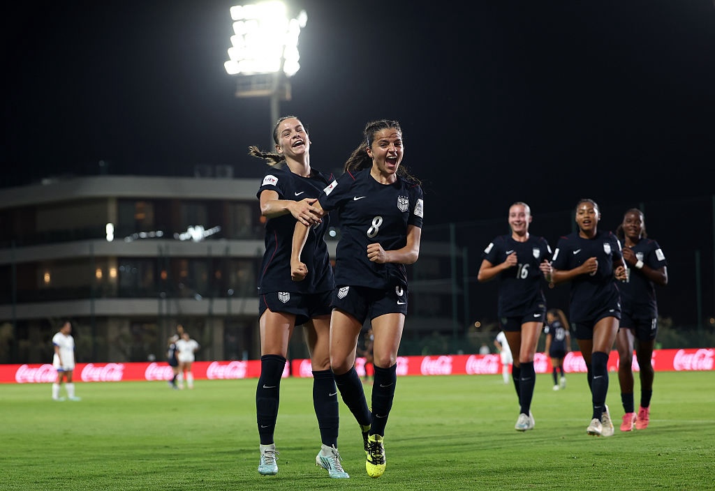 Maddie Dimaria of the USA celebrates with teammate Loradana Paletta after scoring her team’s fourth goal during the FIFA U17 Women's World Cup Group E match between the USA and Samoa at the Mohammed VI Football Complex on October 19, 2026 in Rabat, Morocco.