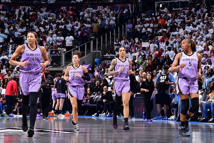 Kiah Stokes #41, Veronica Burton #22, Gabby Williams #1, and Kayla Thornton #5 of the Golden State Valkyries look on during the game against the Atlanta Dream.