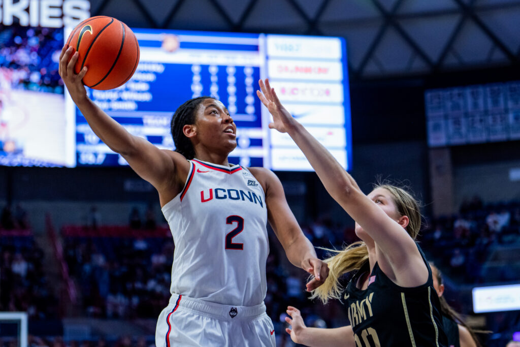 STORRS, CONNECTICUT - OCTOBER 25: KK Arnold #2 of the Connecticut Huskies drives to the rim against Camryn Tade #20 of the Army Black Knights during the second half of an NCAA women's exhibition basketball game at M&T Bank Center at Gampel Pavilion on October 25, 2026 in Storrs, Connecticut.