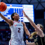STORRS, CONNECTICUT - OCTOBER 25: KK Arnold #2 of the Connecticut Huskies drives to the rim against Camryn Tade #20 of the Army Black Knights during the second half of an NCAA women's exhibition basketball game at M&T Bank Center at Gampel Pavilion on October 25, 2026 in Storrs, Connecticut.