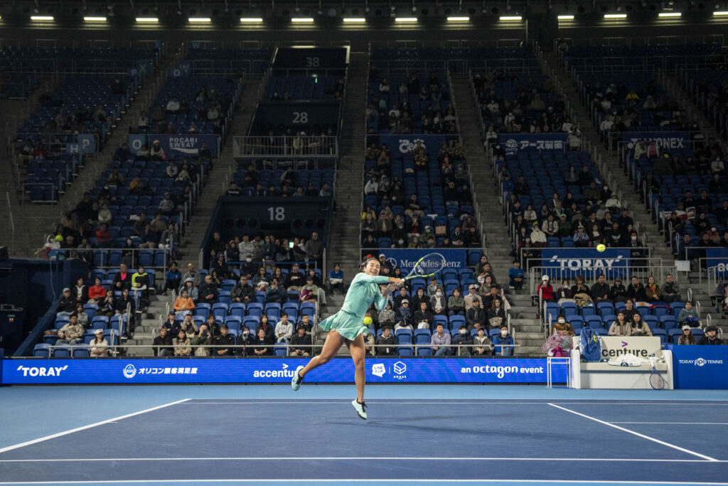 Philippines' Alexandra Eala hits a return against Russia's Diana Shnaider during their quarter-final match at the WTA Pan Pacific Open tennis tournament at Ariake Coliseum in Tokyo.