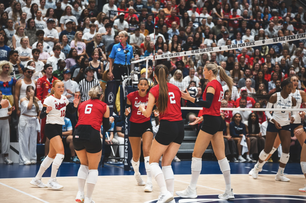 The Nebraska women's volleyball team celebrate a win against Penn State on Thursday.